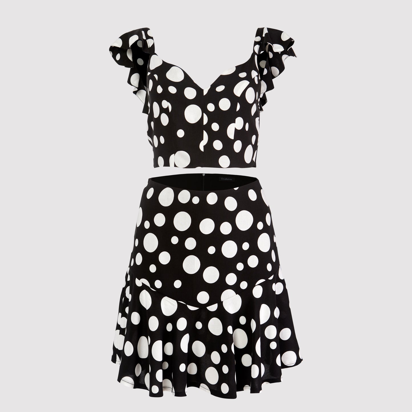 Amelia body hugging mini ruffled skirt, black-white dot printed